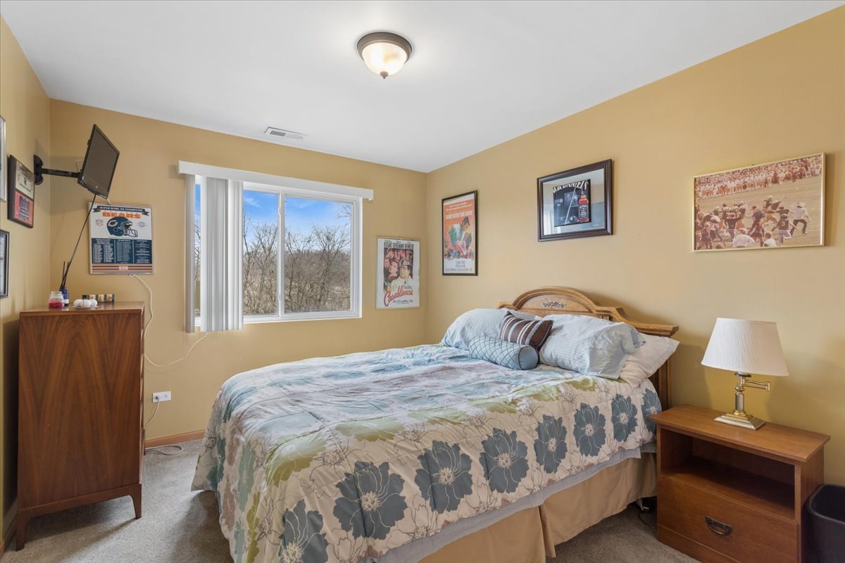 14902 West Victoria Crossing Lockport, IL 60441 - Photo 20 of 23 a bedroom with a bed and a window