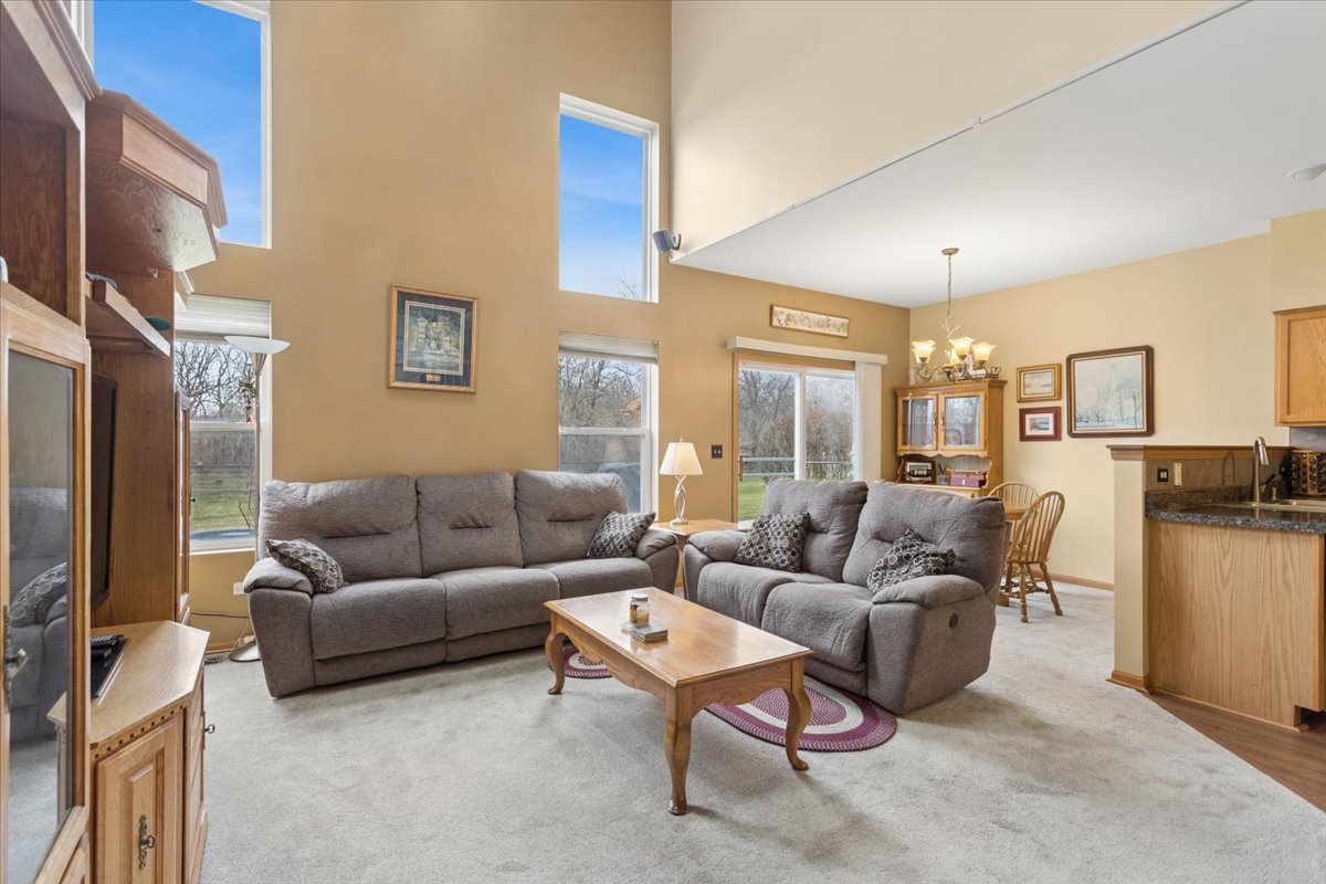 14902 West Victoria Crossing Lockport, IL 60441 - Photo 2 of 23 a living room with furniture and a flat screen tv