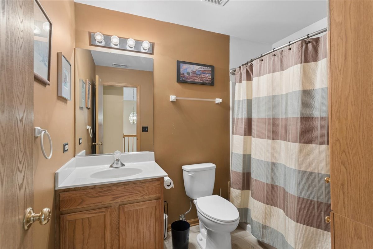 14902 West Victoria Crossing Lockport, IL 60441 - Photo 21 of 23 a bathroom with a sink toilet and shower