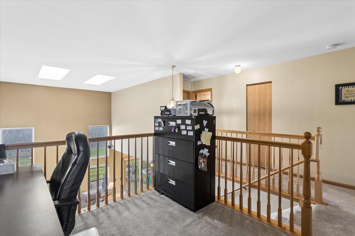 14902 West Victoria Crossing Lockport, IL 60441 - Photo 22 of 23 a view of a hallway with seating area