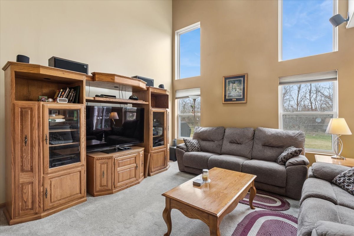 14902 West Victoria Crossing Lockport, IL 60441 - Photo 3 of 23 a living room with furniture and a flat screen tv