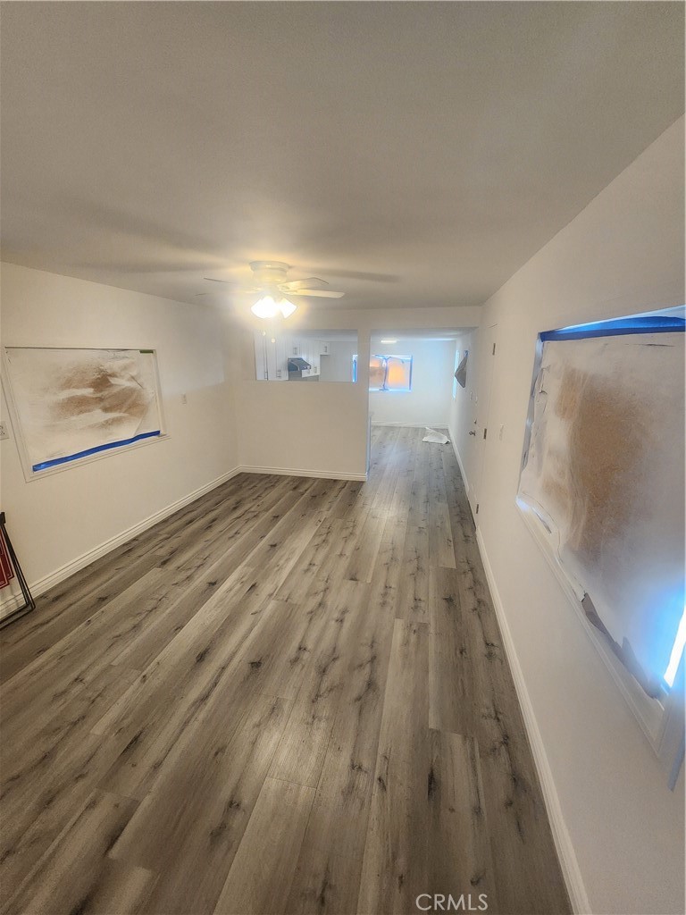3319 Avalon Street, Unit 78 Riverside, CA 92509 - Photo 12 of 37 a view of a hallway with wooden floor