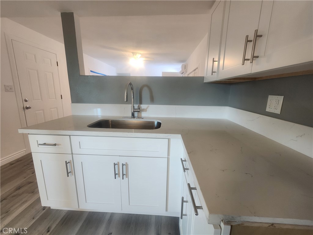 3319 Avalon Street, Unit 78 Riverside, CA 92509 - Photo 14 of 37 a kitchen with a sink and cabinets