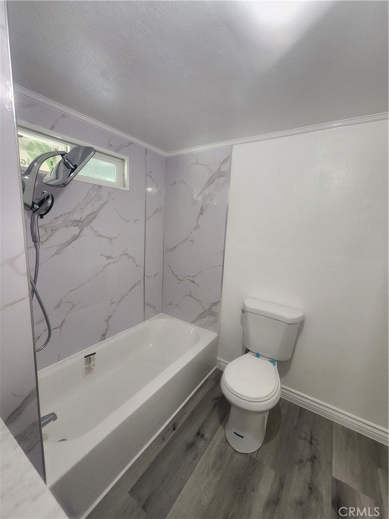 3319 Avalon Street, Unit 78 Riverside, CA 92509 - Photo 31 of 37 a white toilet sitting next to a bath tub and a shower