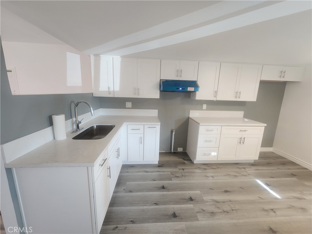 3319 Avalon Street, Unit 78 Riverside, CA 92509 - Photo 37 of 37 a kitchen with cabinets appliances and a sink