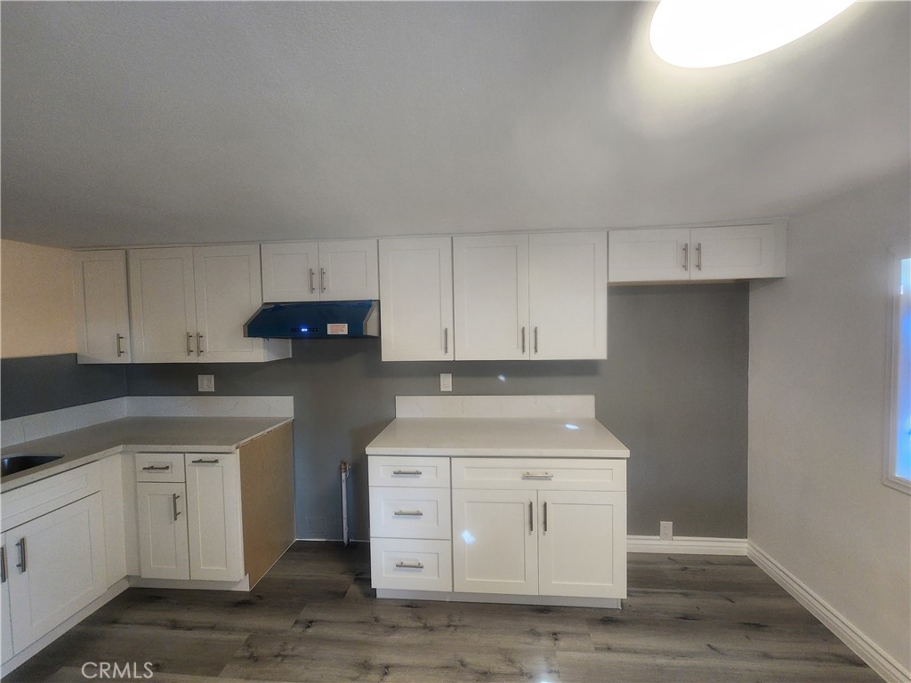 3319 Avalon Street, Unit 78 Riverside, CA 92509 - Photo 9 of 37 a kitchen with white cabinets and white appliances