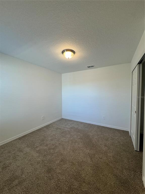4346 Restful Fallow Cove St. Cloud, FL 34772 - Photo 11 of 20 an empty room with a empty space