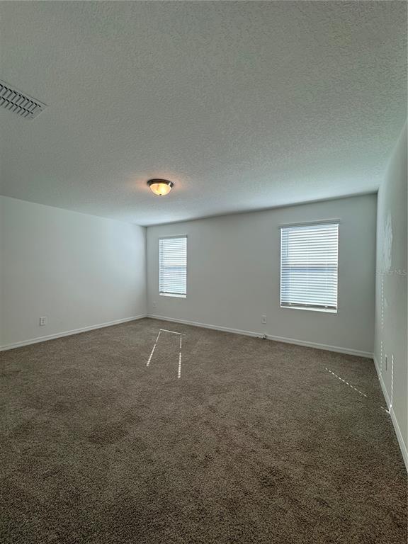 4346 Restful Fallow Cove St. Cloud, FL 34772 - Photo 8 of 20 an empty room with windows