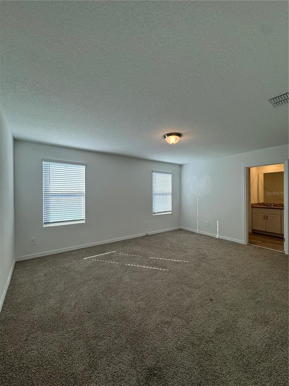 4346 Restful Fallow Cove St. Cloud, FL 34772 - Photo 9 of 20 a view of an empty room with a window and closet area