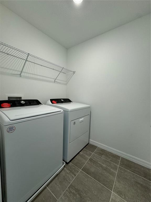 4346 Restful Fallow Cove St. Cloud, FL 34772 - Photo 10 of 20 a utility room with dryer and washer