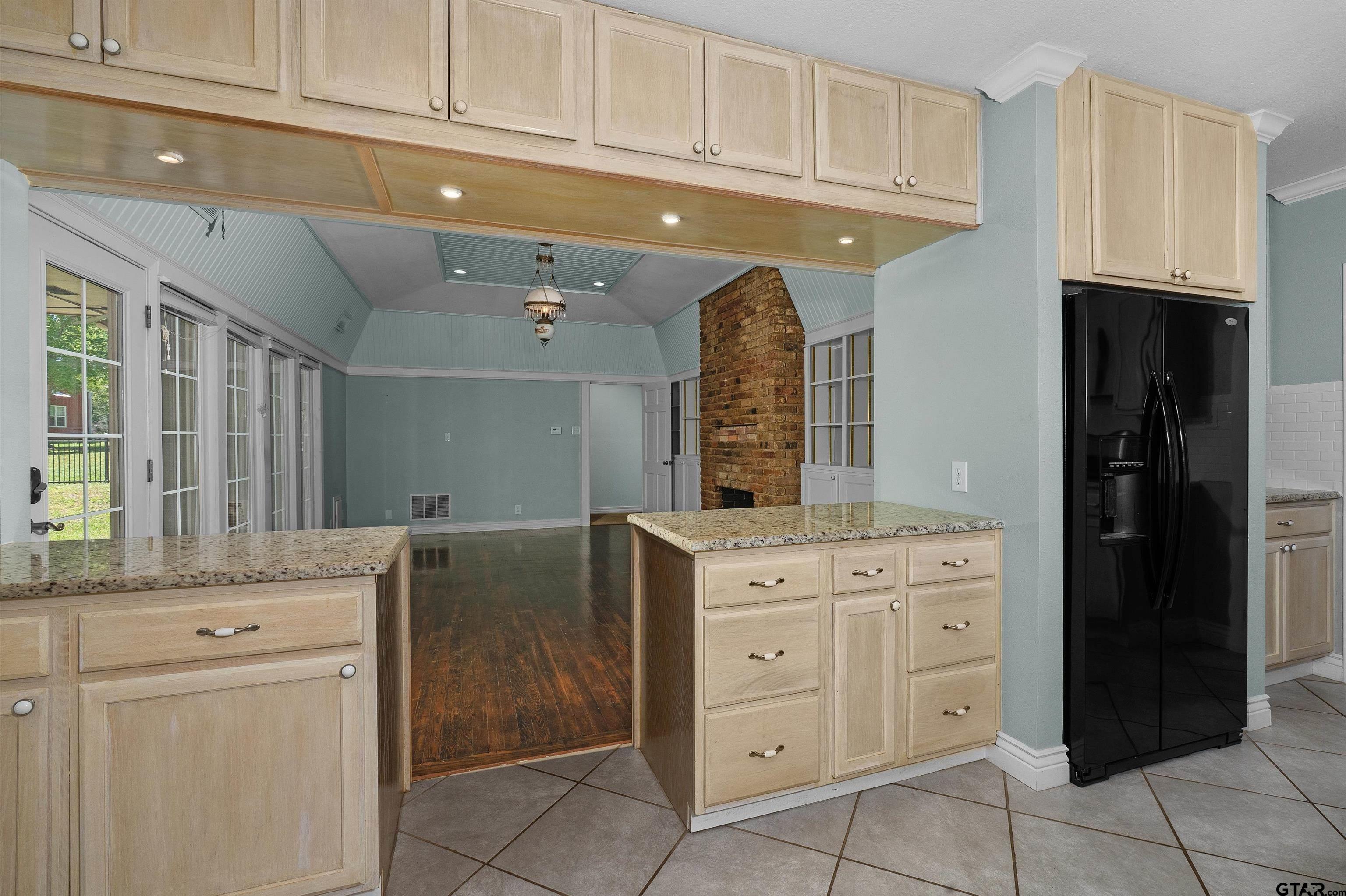 326 East Main Street Henderson, TX 75652 - Photo 14 of 35 a kitchen with cabinets and window