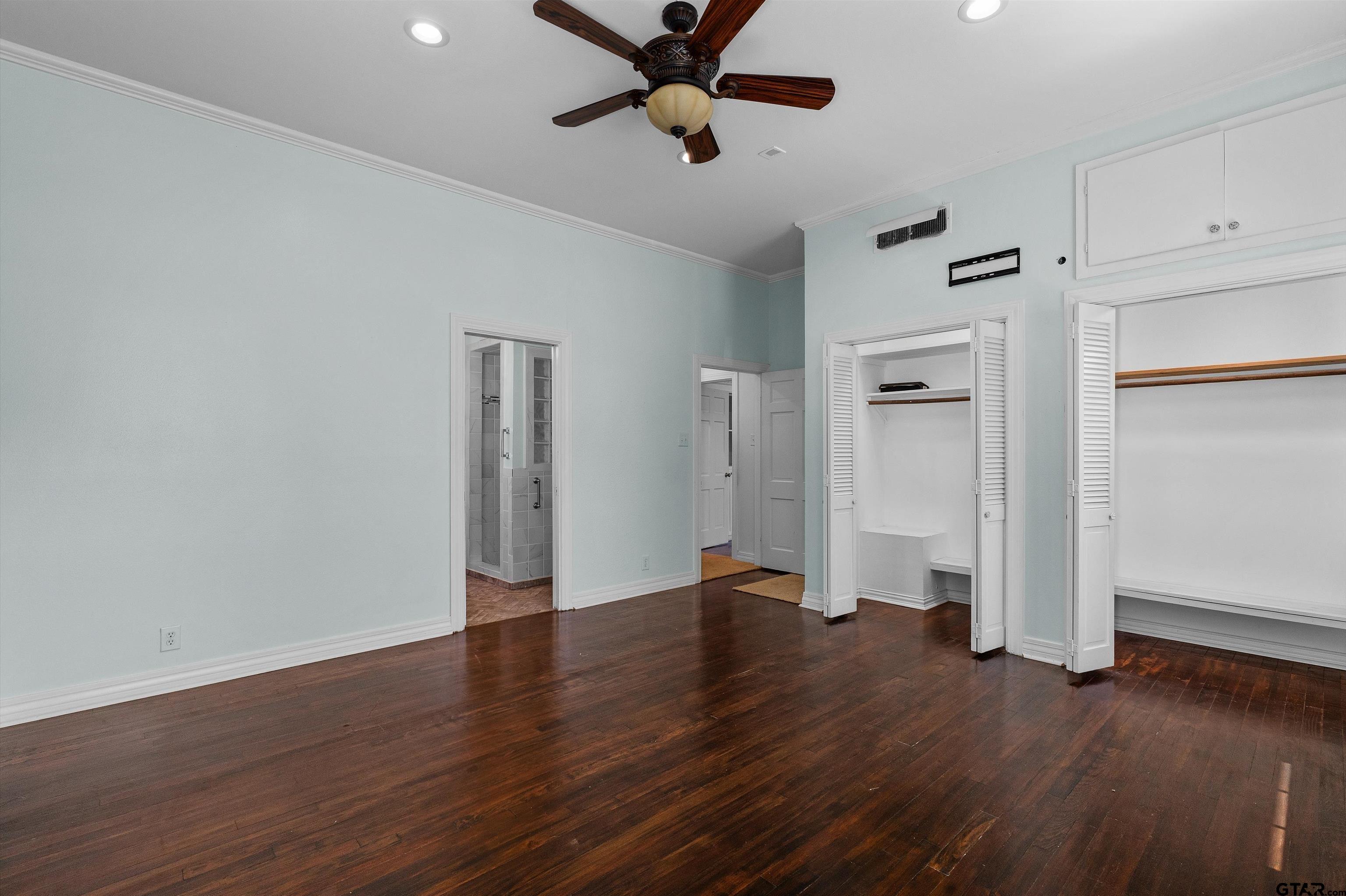 326 East Main Street Henderson, TX 75652 - Photo 19 of 35 a view of an empty room with a window and wooden floor