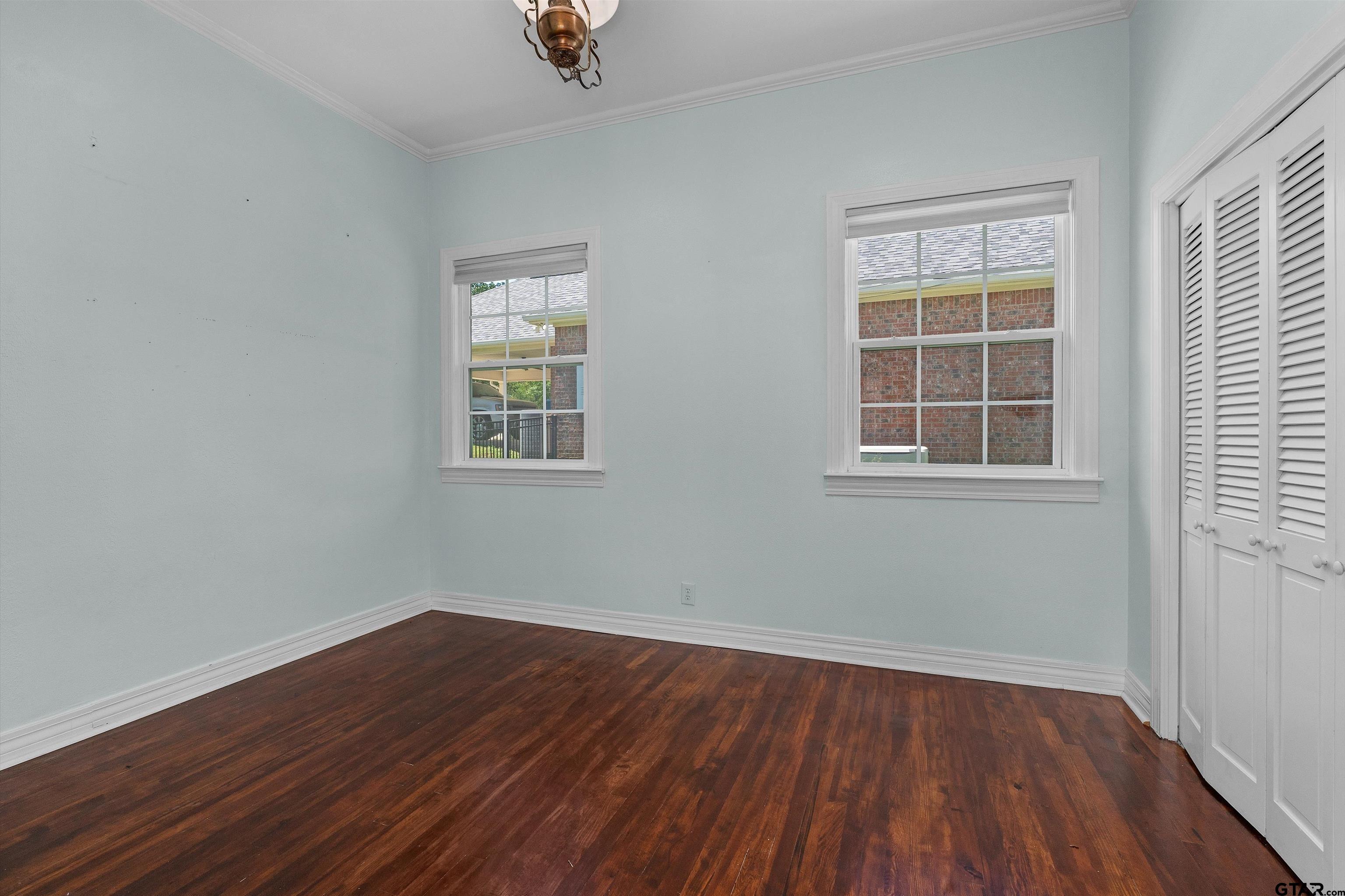 326 East Main Street Henderson, TX 75652 - Photo 22 of 35 a view of empty room with wooden floor and fan