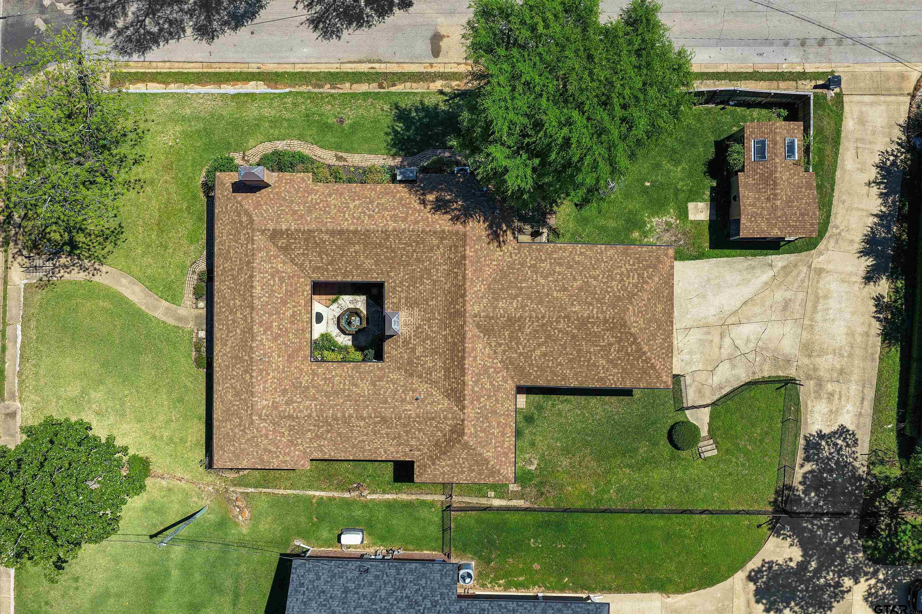 326 East Main Street Henderson, TX 75652 - Photo 3 of 35 an aerial view of a house with a garden