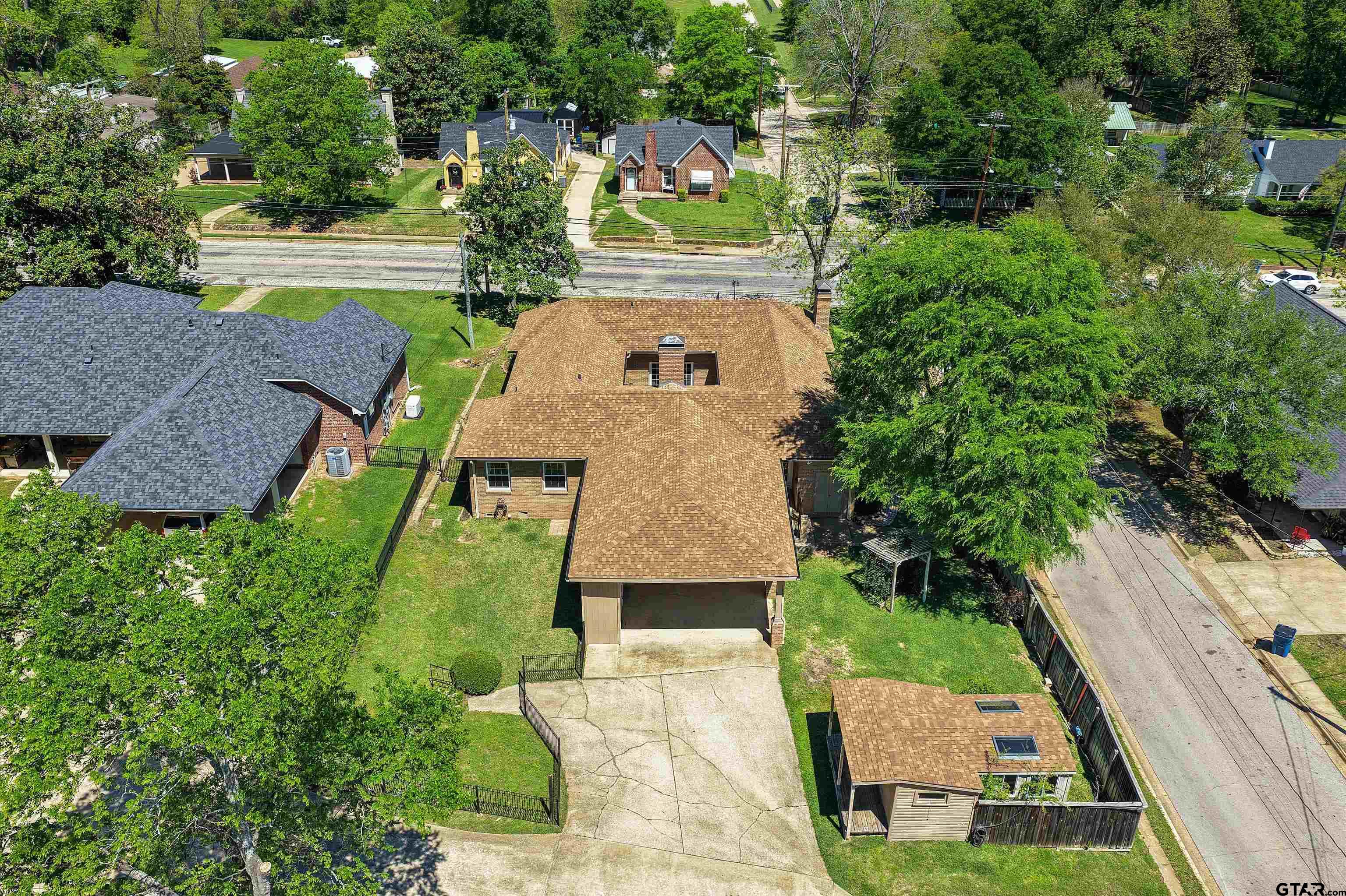 326 East Main Street Henderson, TX 75652 - Photo 33 of 35 an aerial view of a house with garden space and street view