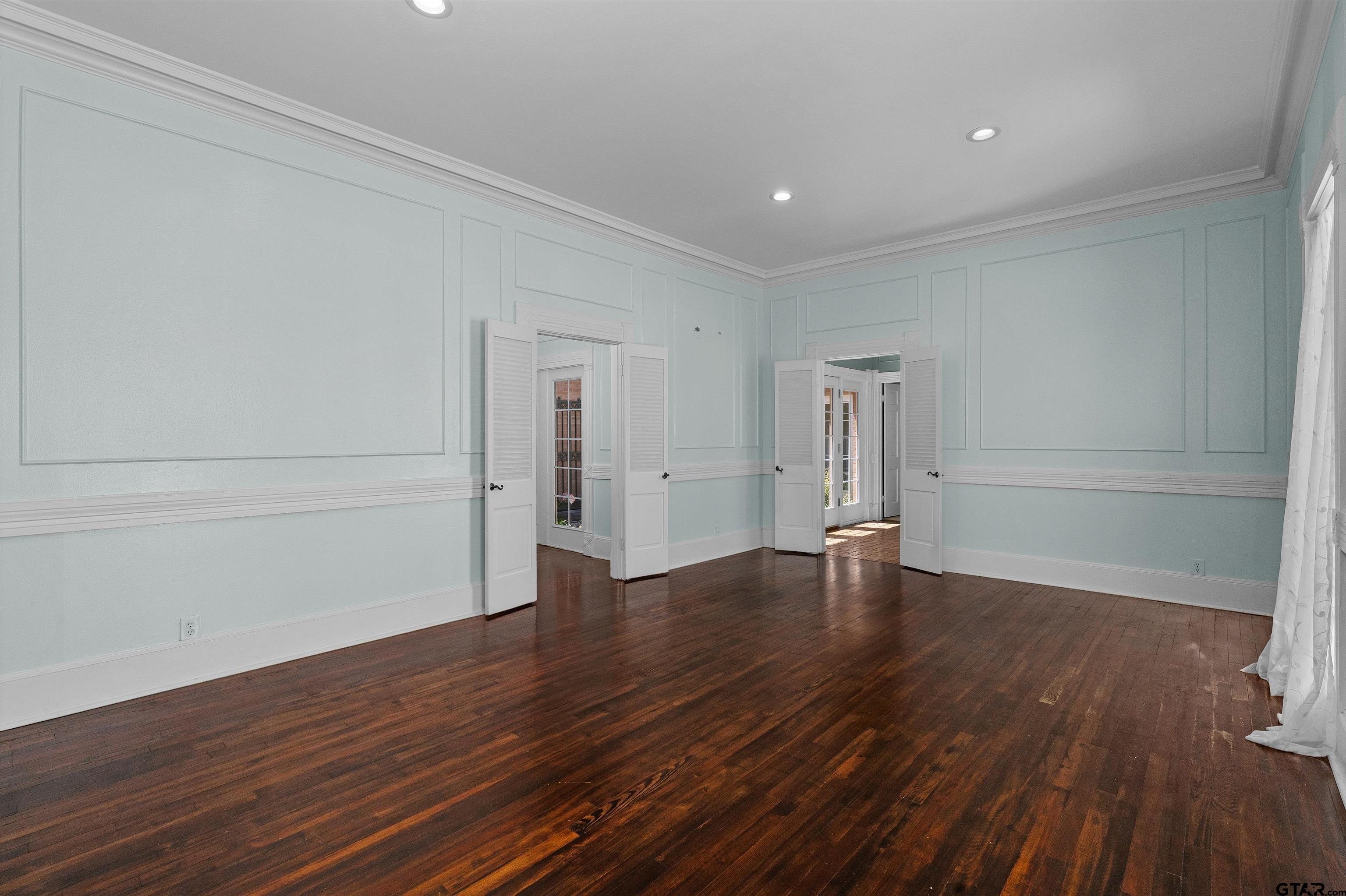 326 East Main Street Henderson, TX 75652 - Photo 9 of 35 a view of empty room with wooden floor and window