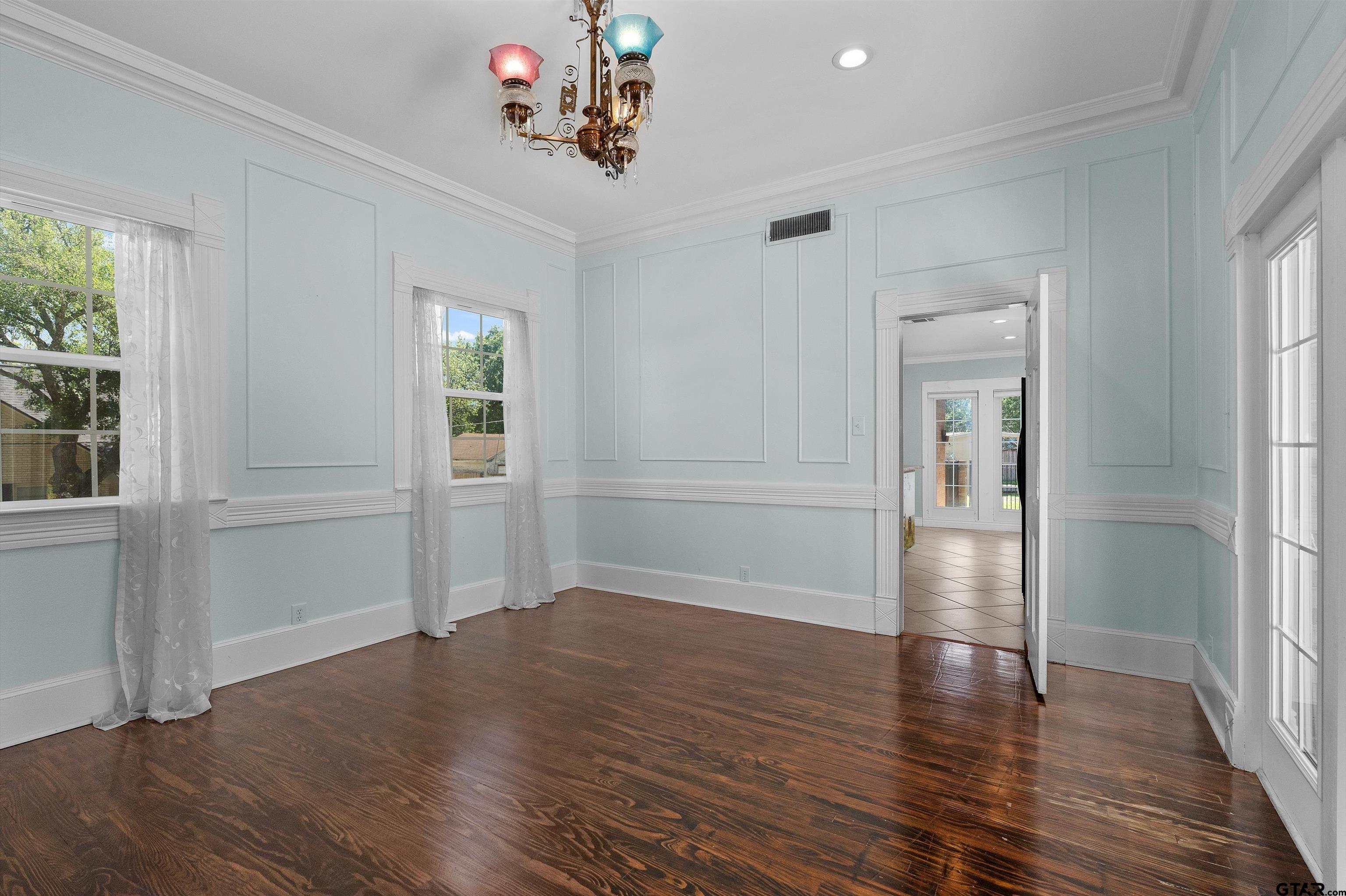 326 East Main Street Henderson, TX 75652 - Photo 10 of 35 wooden floor in an empty room with a window
