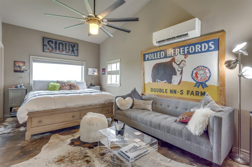 5660 Upper Denton Road Weatherford, TX 76085 - Photo 25 of 39 a bedroom with a bed and window