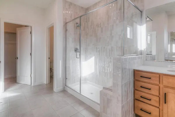a bathroom with a shower and a sink