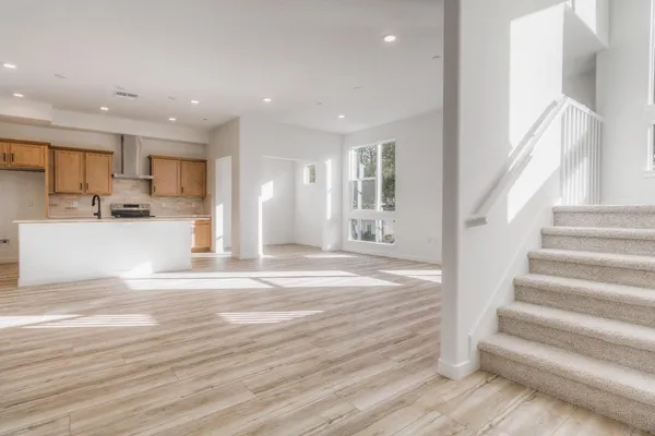 a view of kitchen with wooden floor and electronic appliances