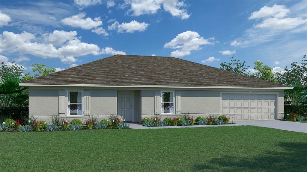 15992 Southwest 27th Ave Road Ocala, FL 34473 - Photo 1 of 1 a front view of house with yard and green space