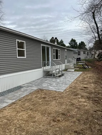 a view of a backyard with sitting area