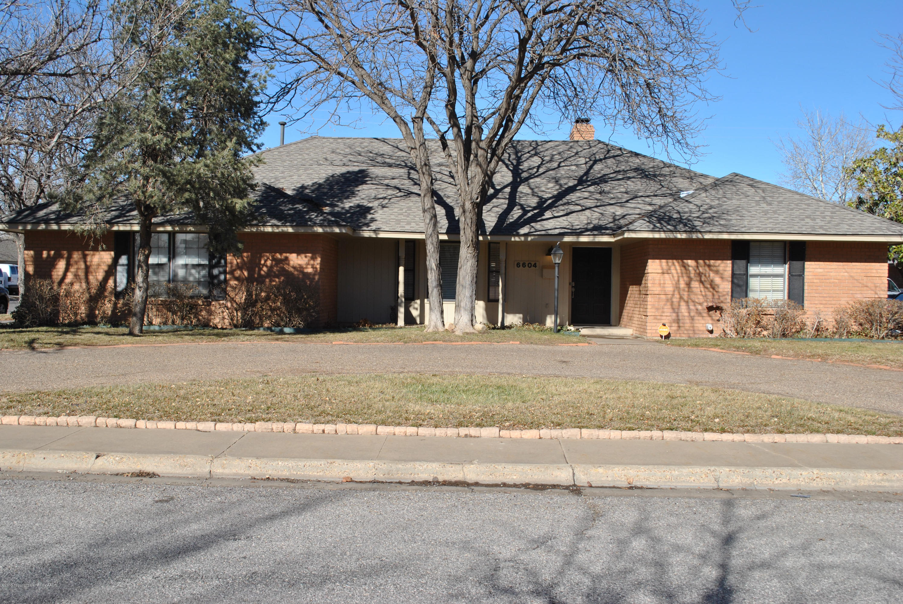 6604 Dreyfuss Road Amarillo, TX 79106 - Photo 1 of 31 a view of a house with snow on the road
