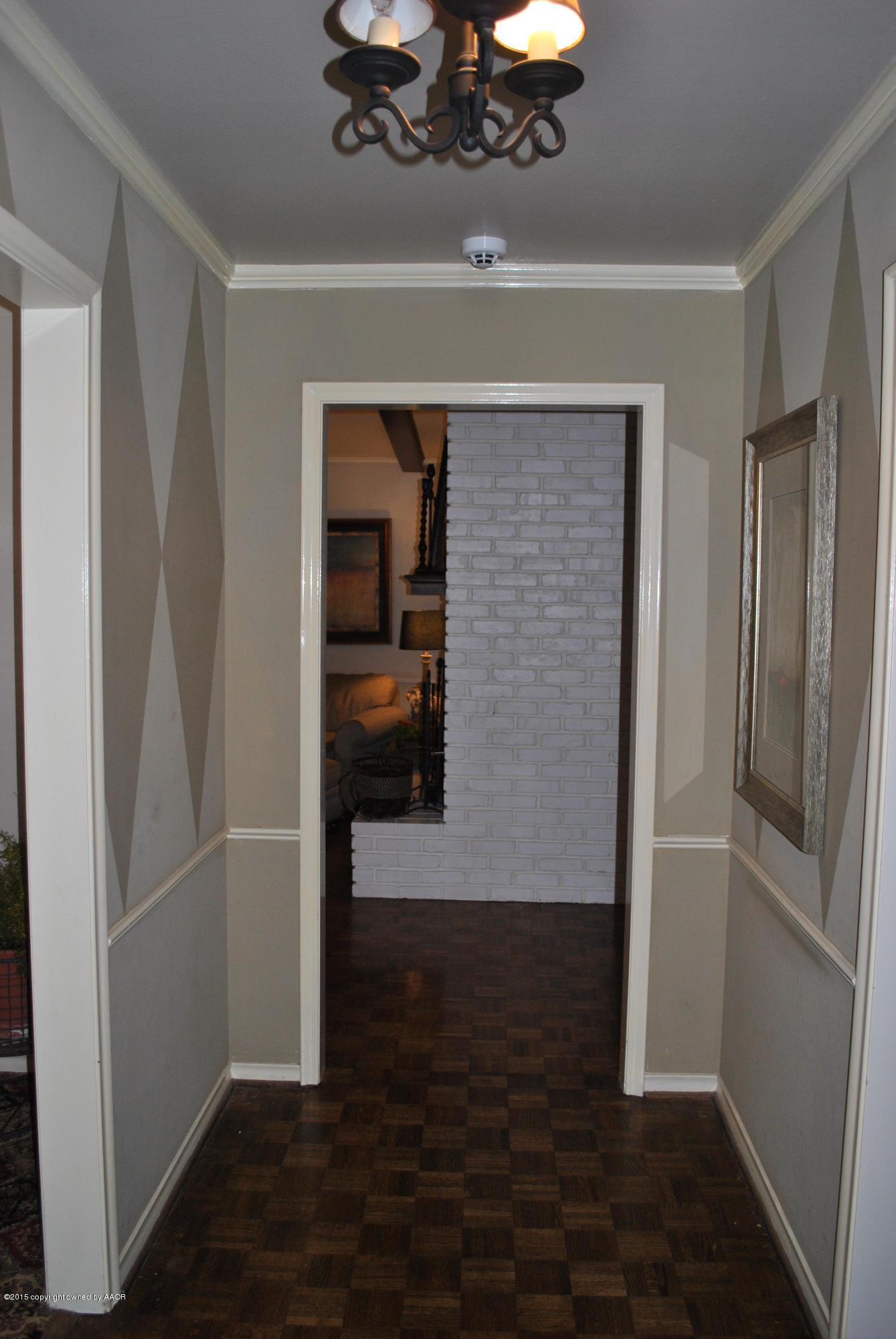 6604 Dreyfuss Road Amarillo, TX 79106 - Photo 15 of 31 a view of a hallway with wooden floor and a cabinet