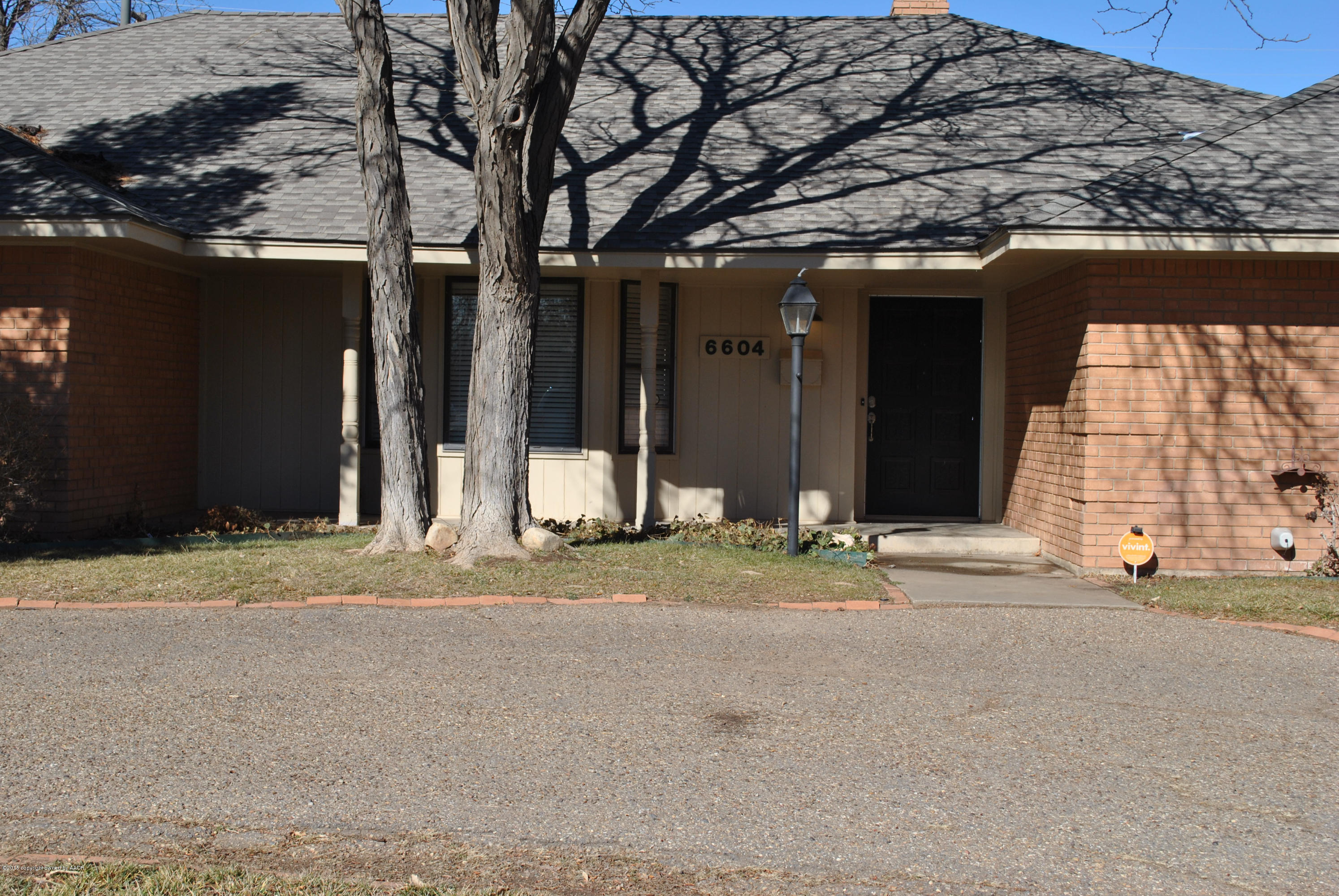 6604 Dreyfuss Road Amarillo, TX 79106 - Photo 2 of 31 a house with trees in front of it