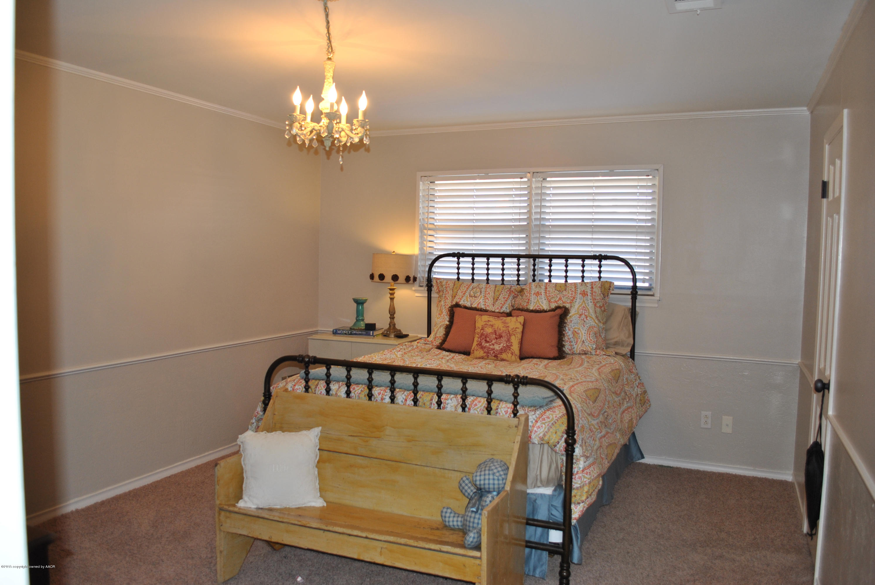 6604 Dreyfuss Road Amarillo, TX 79106 - Photo 26 of 31 a bedroom with a bed and window