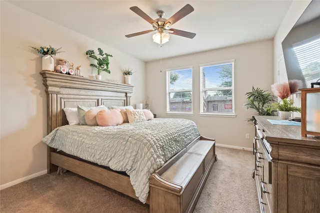 a bedroom with a bed and window