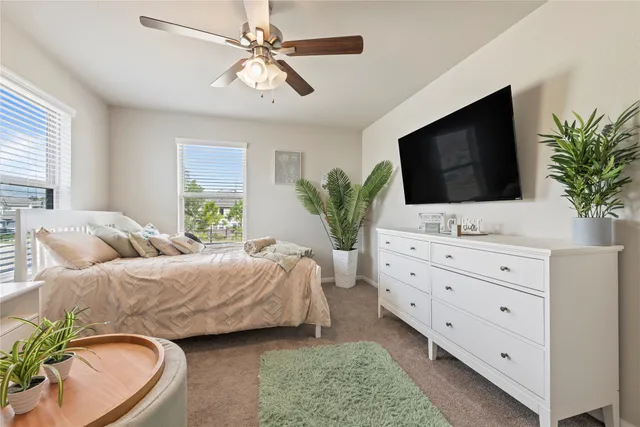 a bedroom with a bed and a flat screen television