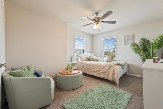 a bedroom with a bed and a couch