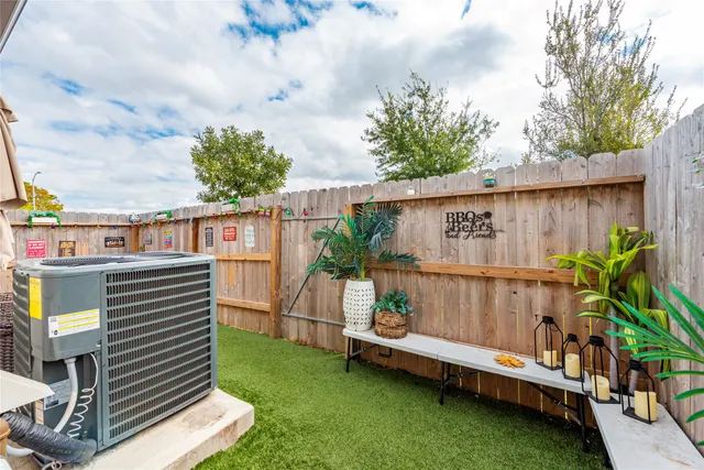a view of a chairs setting in the backyard