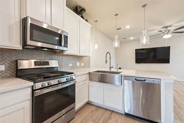 a kitchen with a stove and a microwave