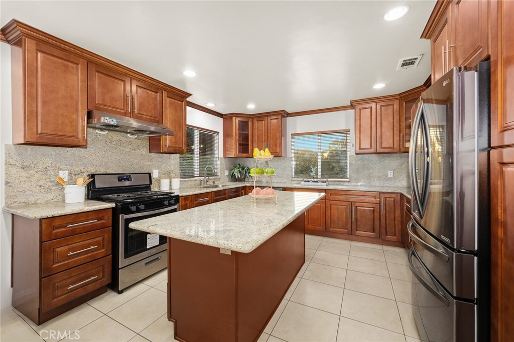 5620 Halifax Road Arcadia, CA 91007 - Photo 7 of 21 a kitchen with stainless steel appliances granite countertop a stove top oven a sink dishwasher and a refrigerator