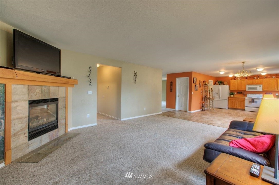 24425 101st Place Southeast Kent, WA 98030 - Photo 13 of 28 a view of livingroom with furniture and fireplace