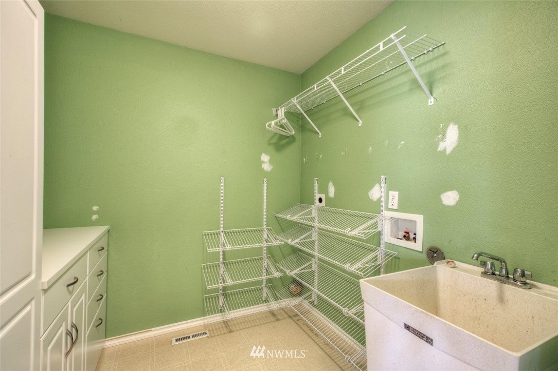 24425 101st Place Southeast Kent, WA 98030 - Photo 15 of 28 a bathroom with a sink and shower