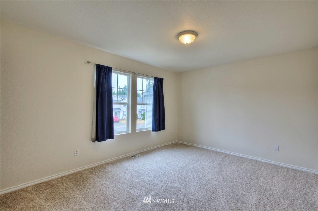 24425 101st Place Southeast Kent, WA 98030 - Photo 19 of 28 an empty room with windows