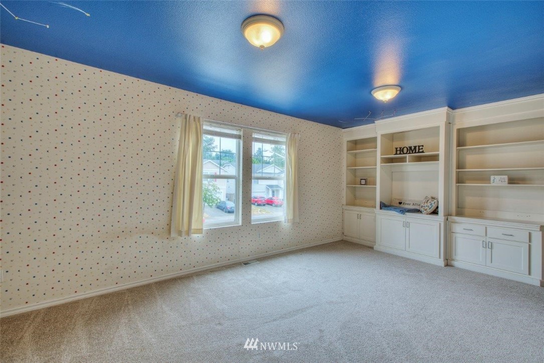 24425 101st Place Southeast Kent, WA 98030 - Photo 20 of 28 a view of an empty room with a window