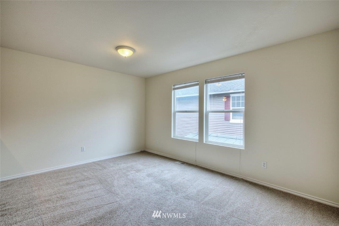 24425 101st Place Southeast Kent, WA 98030 - Photo 22 of 28 an empty room with a window