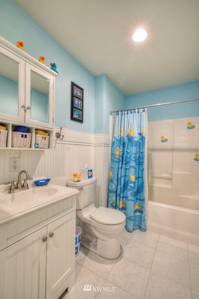 24425 101st Place Southeast Kent, WA 98030 - Photo 24 of 28 a bathroom with a sink a toilet and shower