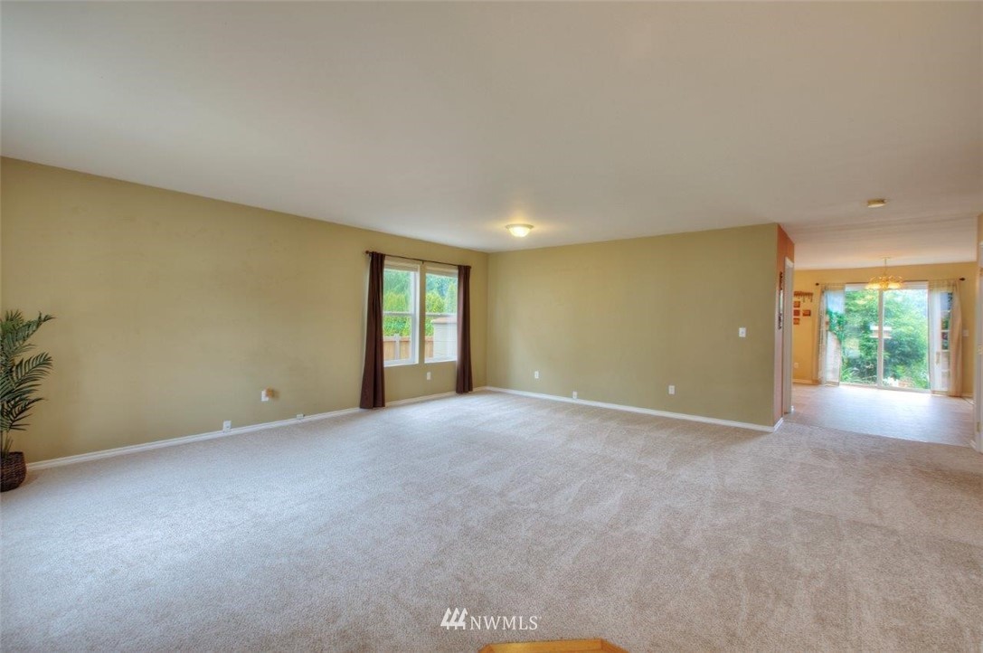 24425 101st Place Southeast Kent, WA 98030 - Photo 4 of 28 a view of an empty room with a window