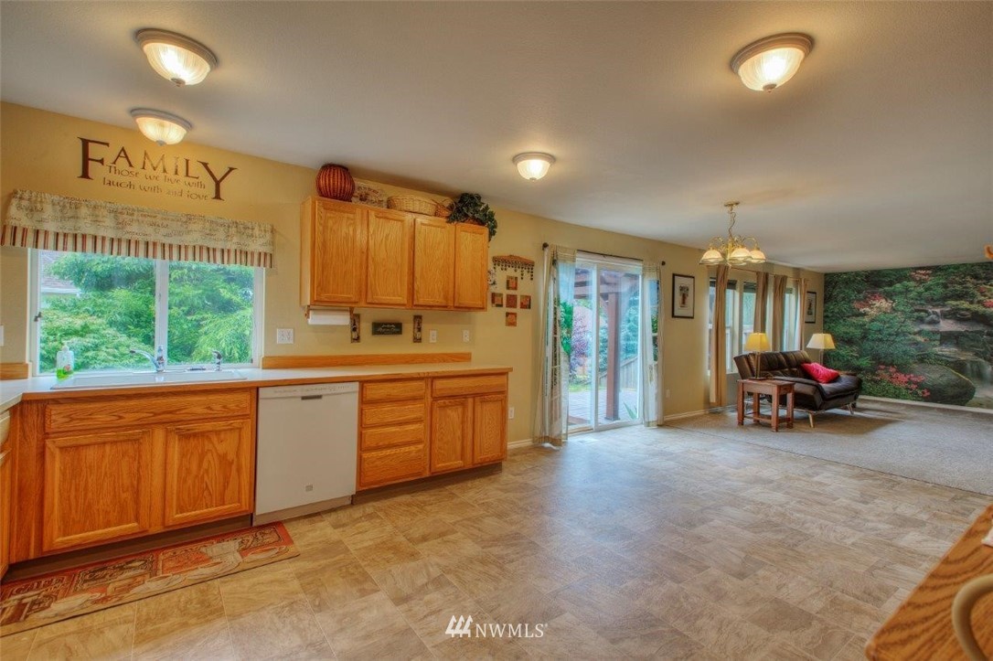 24425 101st Place Southeast Kent, WA 98030 - Photo 9 of 28 a view of a kitchen with utility room and windows