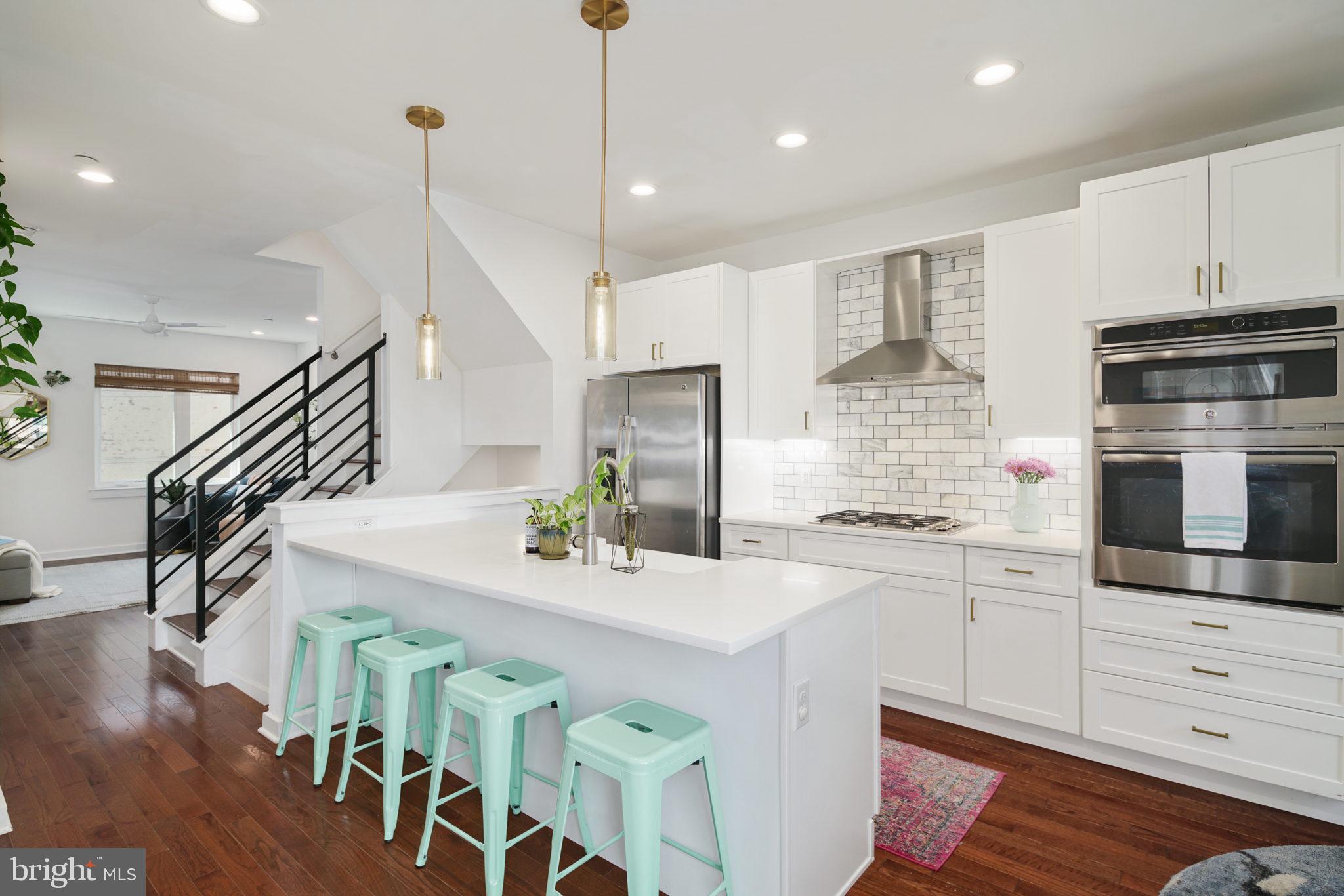 159 East Allen Street, Unit 1 Philadelphia, PA 19125 - Photo 1 of 45 a kitchen with stainless steel appliances kitchen island granite countertop a stove a sink and a refrigerator