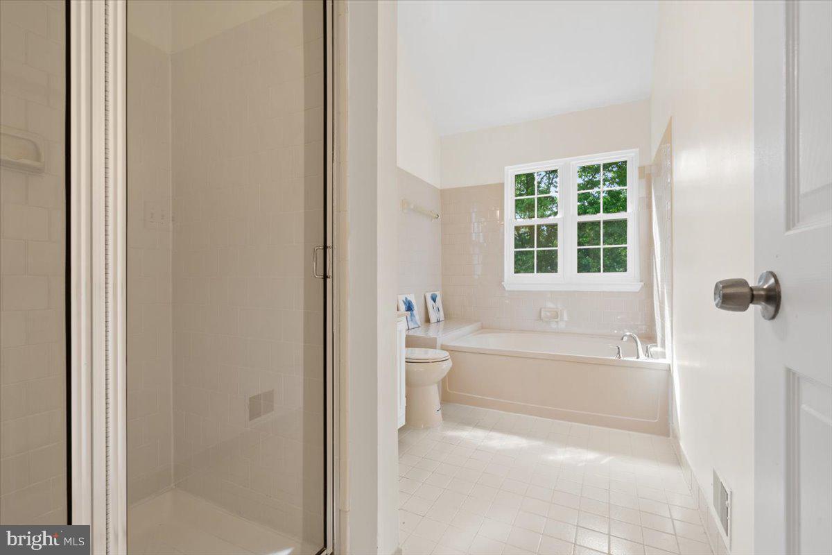 9671 Horsham Drive Laurel, MD 20723 - Photo 22 of 48 Bathroom with bathtub and shower.