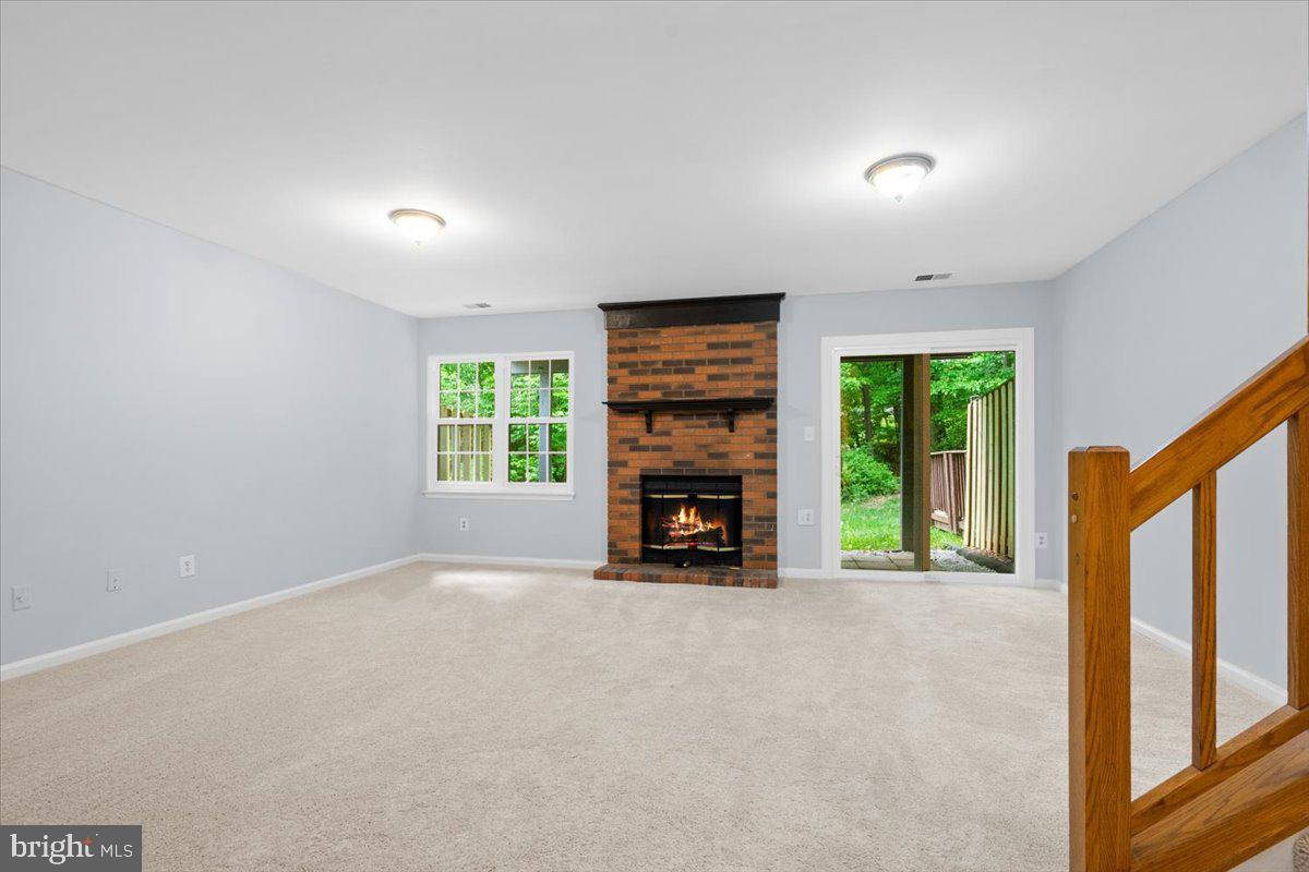 9671 Horsham Drive Laurel, MD 20723 - Photo 30 of 48 Lower walk-out level with fireplace.