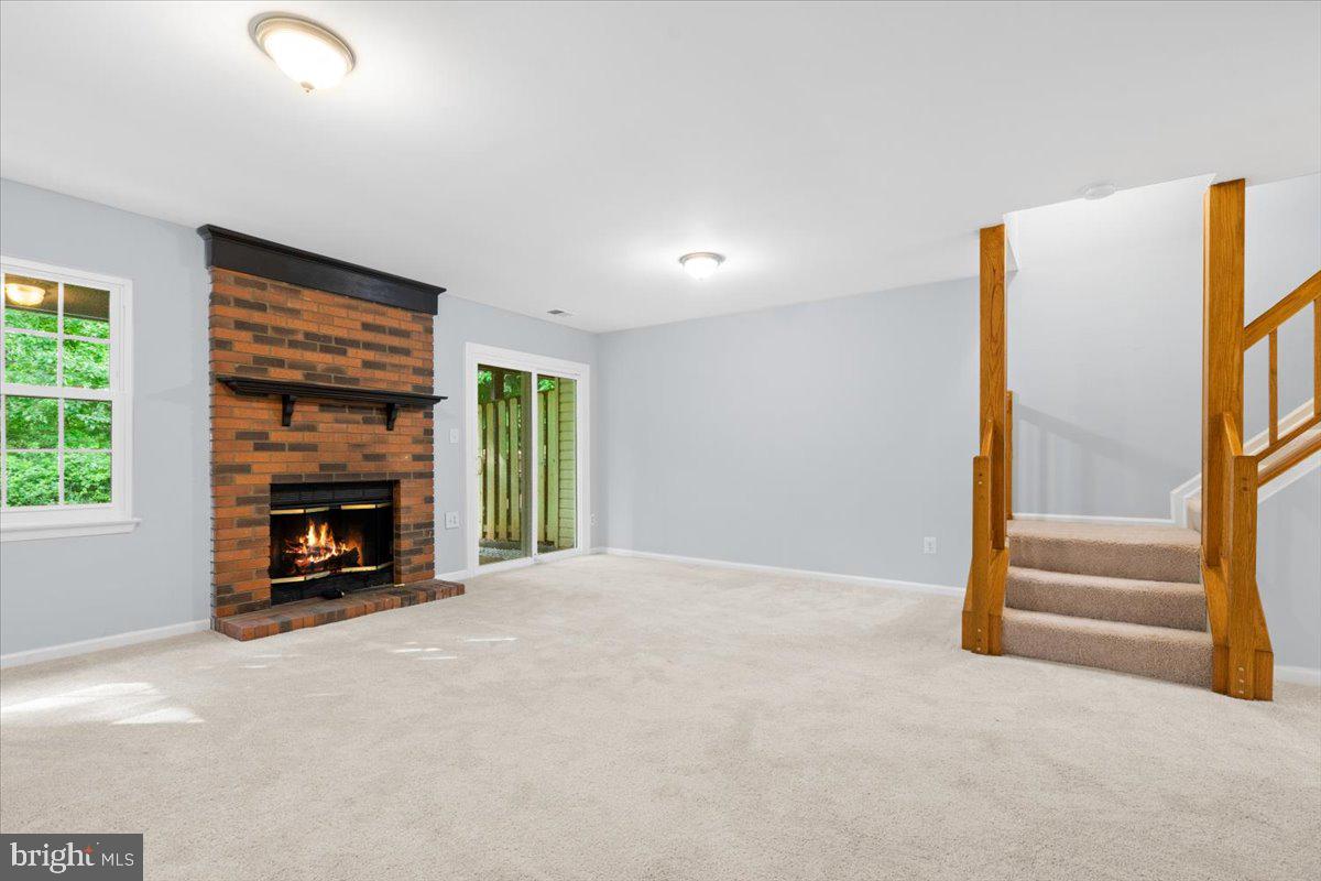 9671 Horsham Drive Laurel, MD 20723 - Photo 31 of 48 Lower walk-out level with fireplace.