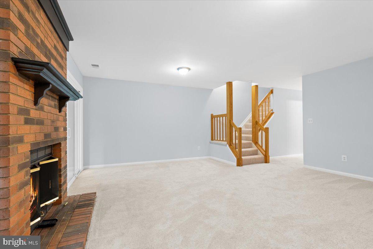 9671 Horsham Drive Laurel, MD 20723 - Photo 32 of 48 Lower walk-out level with fireplace.