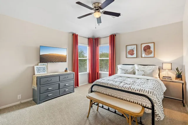 a bedroom with a bed and a dresser